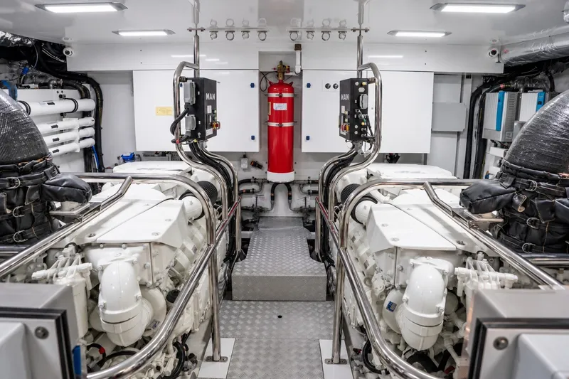 Slide: The Image of Engine room of 2021 Princess Y85 yacht, featuring dual engines and modern equipment. - 71
