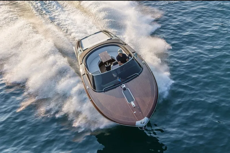 Slide: The Image of 2025 Riva 33' Aquariva Special cruising on open water, showcasing sleek design and speed. - 1