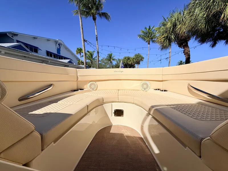 Slide: The Image of The image shows the cockpit of a 2019 Chris-Craft Launch 28 GT OB with beige upholstery. - 29