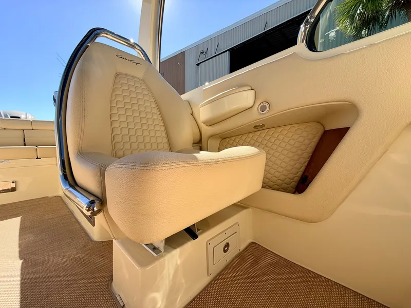 Slide: The Image of Interior of a 2019 Chris-Craft Launch 28 GT OB with a beige upholstered seat. - 42
