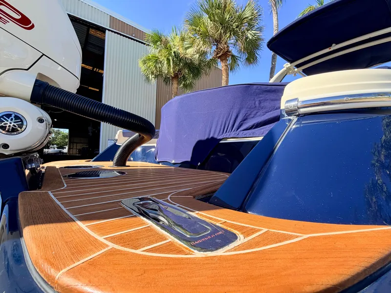 Slide: The Image of The image shows the teak deck of a 2019 Chris-Craft Launch 28 GT OB. - 22