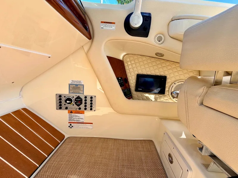 Slide: The Image of Interior of a 2019 Chris-Craft Launch 28 GT OB with elegant seating and controls. - 44