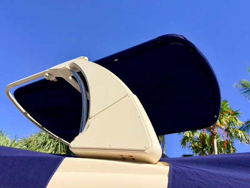 Slide: The Image of A sunshade on a Chris-Craft Launch 28 GT OB boat against a blue sky. - 24