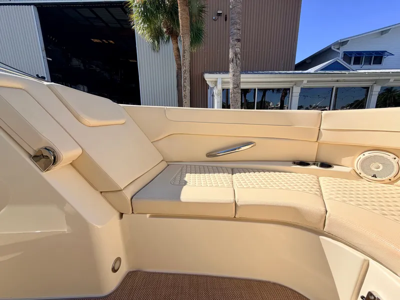 Slide: The Image of Interior view of a 2019 Chris-Craft Launch 28 GT OB with beige upholstery. - 32