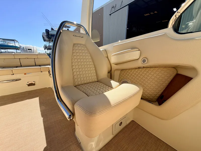 Slide: The Image of Interior of a 2019 Chris-Craft Launch 28 GT OB with beige upholstery and elegant details. - 45
