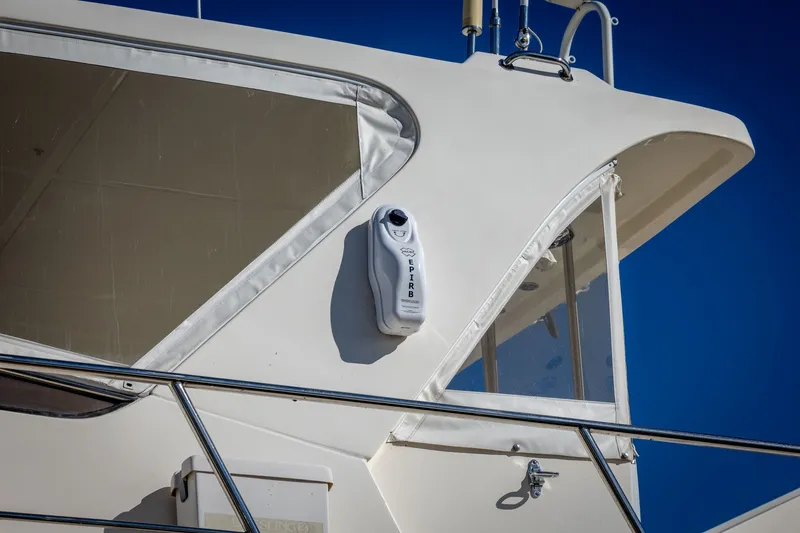 Slide: The Image of 2019 Marlow Explorer 49E yacht detail with EPIRB against clear blue sky. - 20