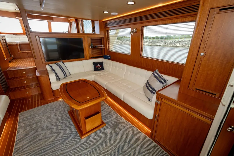 Slide: The Image of Luxurious interior of 2019 Marlow Explorer 49E yacht with plush seating and elegant wood finishes. - 33