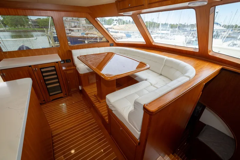 Slide: The Image of Luxurious interior of 2019 Marlow Explorer 49E yacht with elegant wood and white seating. - 50