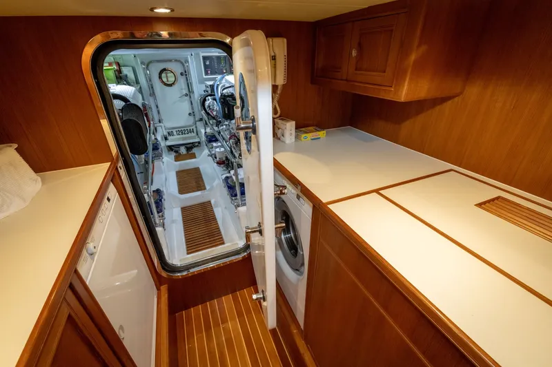 Slide: The Image of Laundry area on 2019 Marlow Explorer 49E yacht with engine room access. - 70