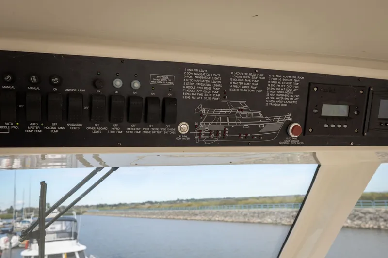 Slide: The Image of Control panel of a 2019 Marlow Explorer 49E yacht with switches and diagram. - 84