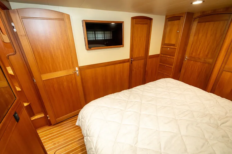 Slide: The Image of Luxurious cabin interior of 2019 Marlow Explorer 49E yacht with wood paneling. - 55