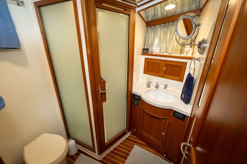 Slide: The Image of Luxurious 2019 Marlow Explorer 49E yacht bathroom with wood accents and modern fixtures. - 66