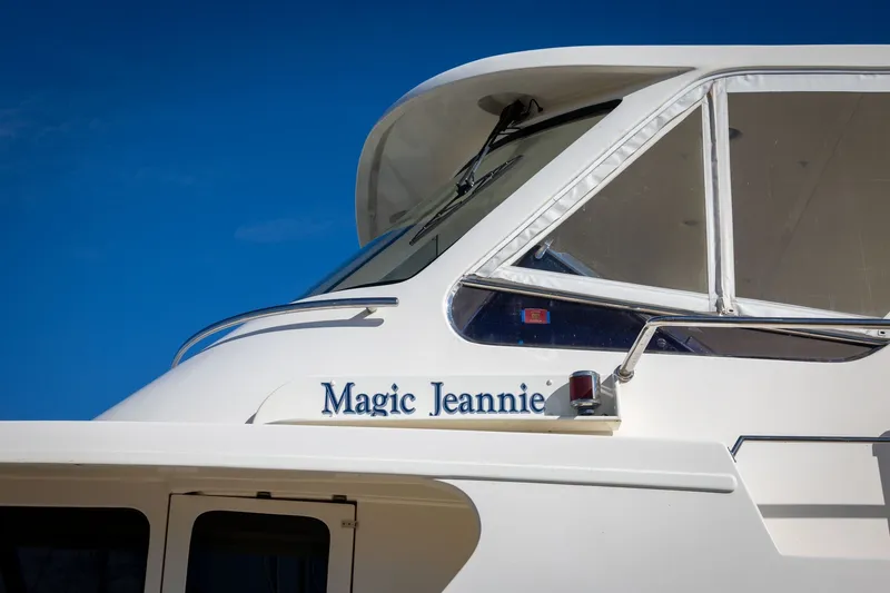 Slide: The Image of 2019 Marlow Explorer 49E yacht "Magic Jeannie" against clear blue sky. - 23