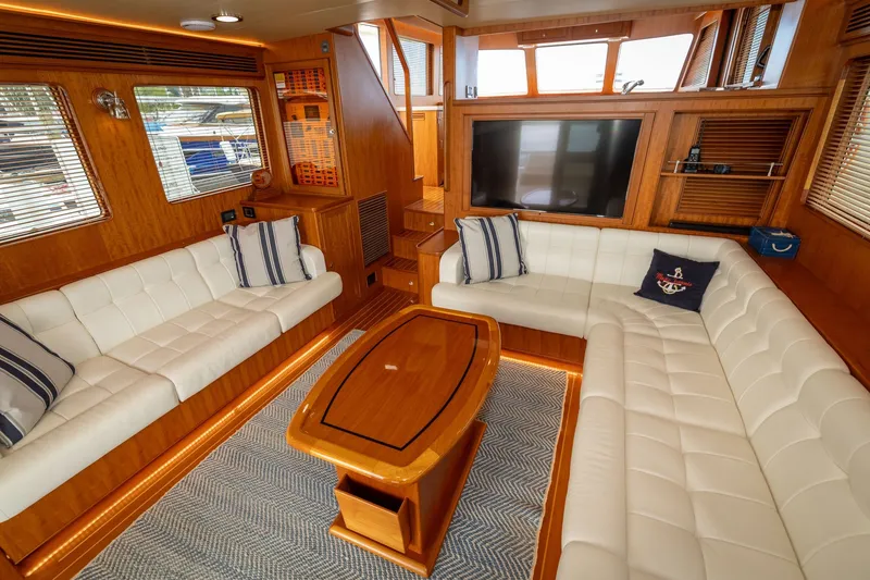 Slide: The Image of Luxurious interior of 2019 Marlow Explorer 49E yacht with plush seating and elegant wood finishes. - 32