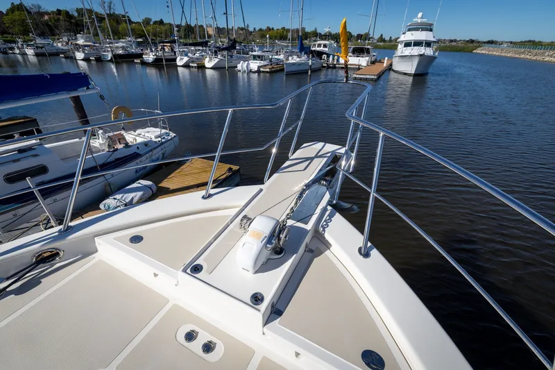 Slide: The Image of Bow view of 2019 Marlow Explorer 49E yacht docked in a marina. - 22