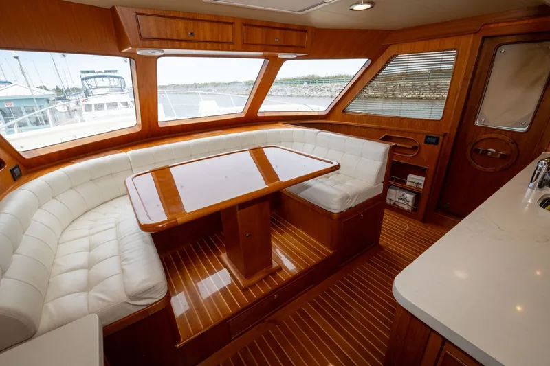 Slide: The Image of Luxurious interior of 2019 Marlow Explorer 49E yacht with elegant wood and leather seating. - 51