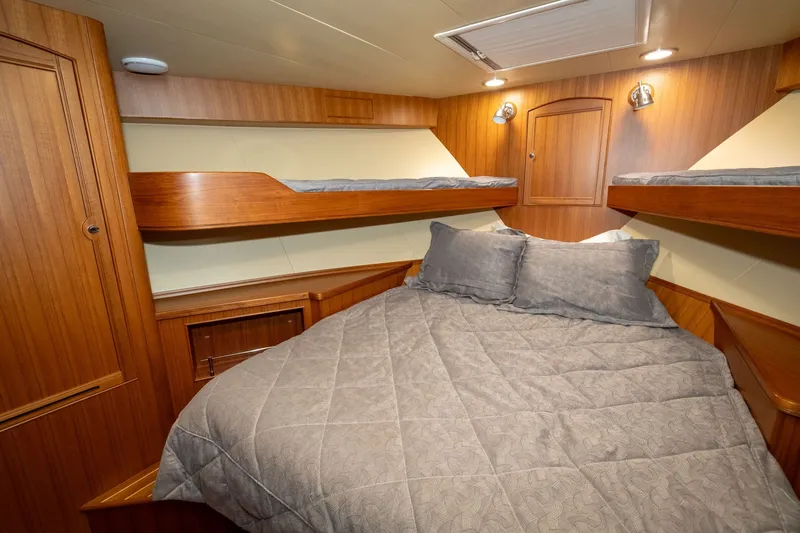 Slide: The Image of Luxurious cabin interior of 2019 Marlow Explorer 49E yacht with cozy bedding. - 61