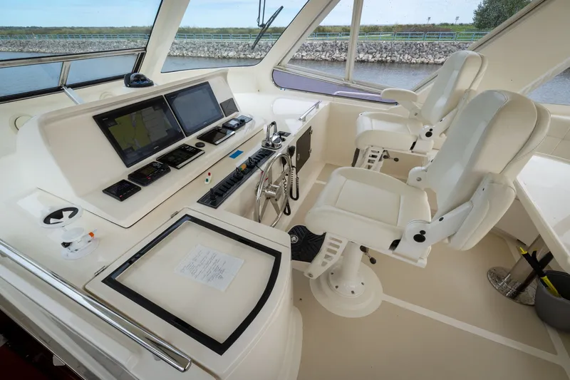 Slide: The Image of Helm of 2019 Marlow Explorer 49E yacht with dual seats and navigation screens. - 80