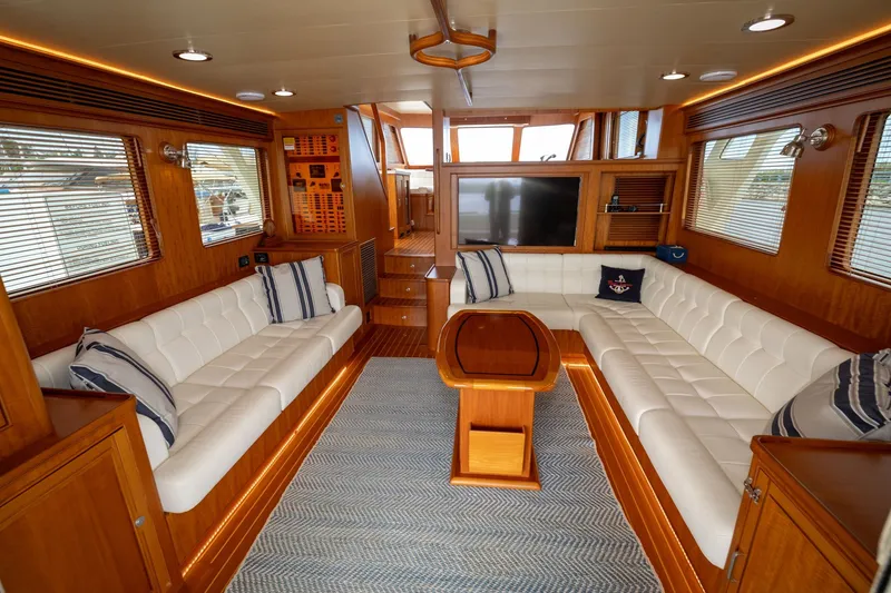 Slide: The Image of Luxurious interior of 2019 Marlow Explorer 49E yacht with white seating and wooden accents. - 31