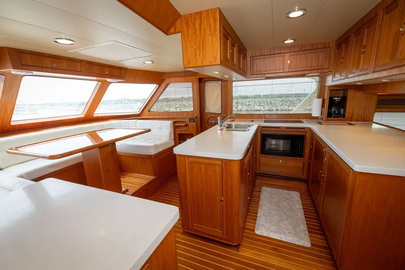 Slide: The Image of Luxurious interior of 2019 Marlow Explorer 49E yacht with modern kitchen and dining area. - 43