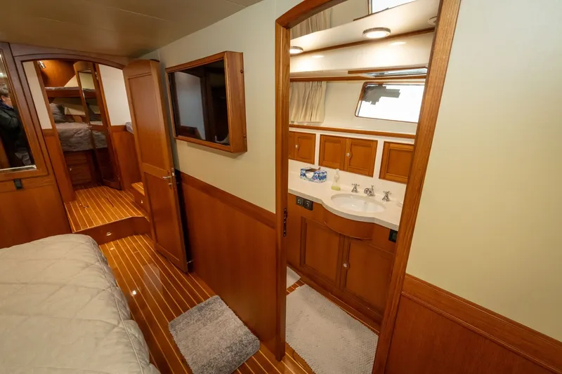 Slide: The Image of Luxurious interior of 2019 Marlow Explorer 49E yacht with wood finishes and cozy cabin. - 57