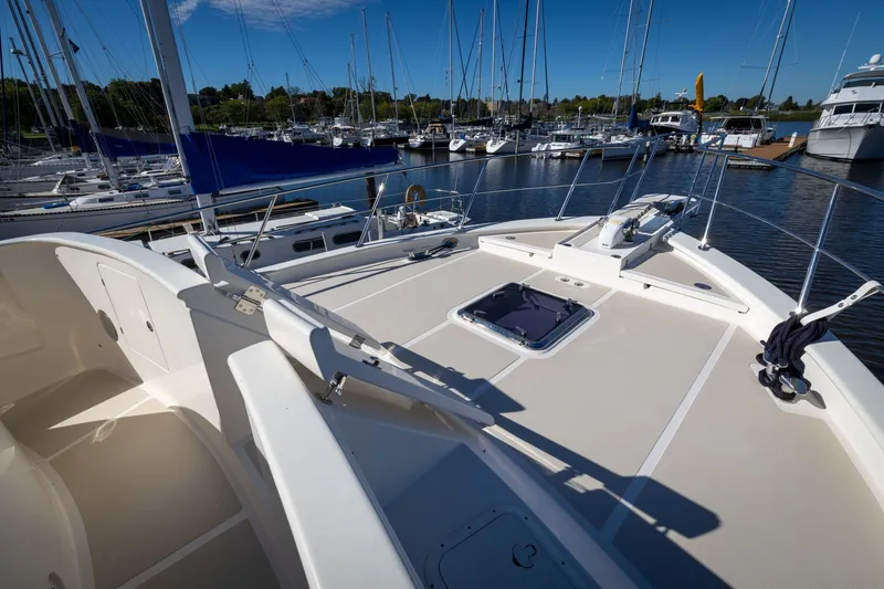 Slide: The Image of 2019 Marlow Explorer 49E yacht docked at marina, sunny day, clear blue sky. - 21