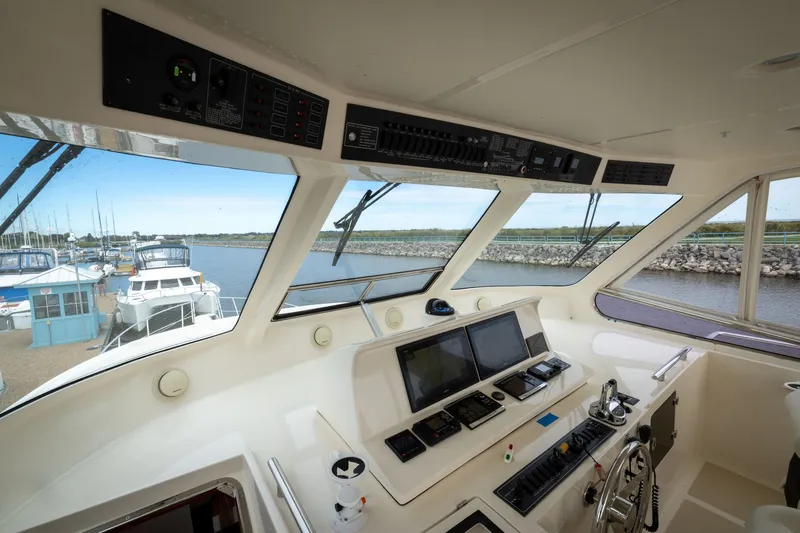 Slide: The Image of Interior view of 2019 Marlow Explorer 49E yacht cockpit with navigation equipment. - 82