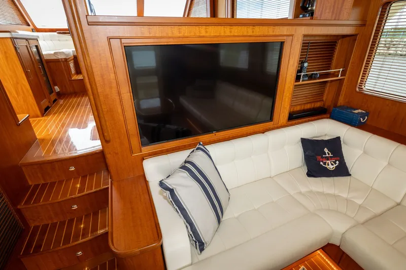 Slide: The Image of Luxurious interior of 2019 Marlow Explorer 49E yacht with plush seating and wooden finishes. - 36