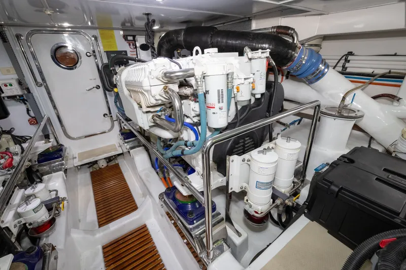 Slide: The Image of Engine room of 2019 Marlow Explorer 49E yacht, featuring advanced machinery and equipment. - 74