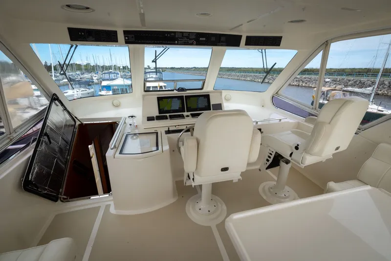 Slide: The Image of Interior helm of 2019 Marlow Explorer 49E yacht with navigation equipment. - 79