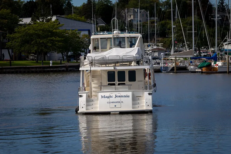 Slide: The Image of 2019 Marlow Explorer 49E yacht "Magic Jeannie" cruising in a marina, Clearwater, FL. - 4