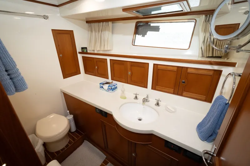 Slide: The Image of Luxurious bathroom interior of 2019 Marlow Explorer 49E yacht with wooden cabinetry. - 58
