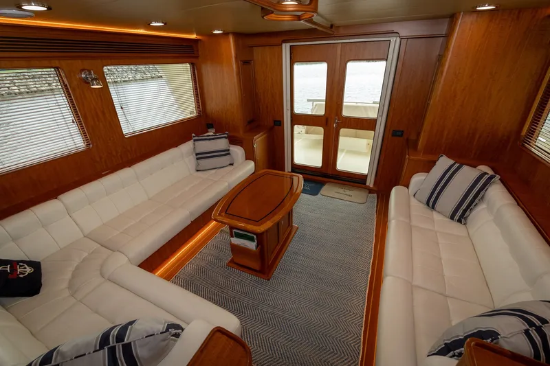 Slide: The Image of Luxurious interior of 2019 Marlow Explorer 49E yacht with elegant seating and wooden finishes. - 34