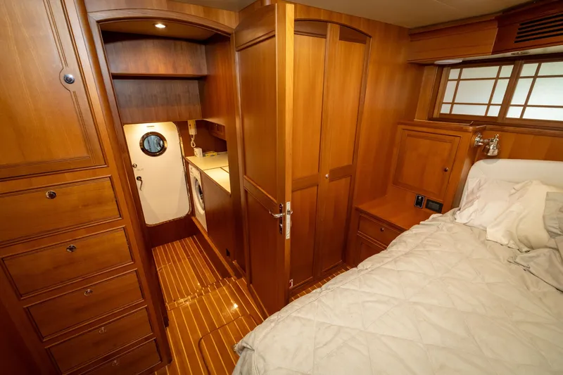 Slide: The Image of Luxurious cabin interior of 2019 Marlow Explorer 49E yacht with wood finish and cozy bedding. - 67