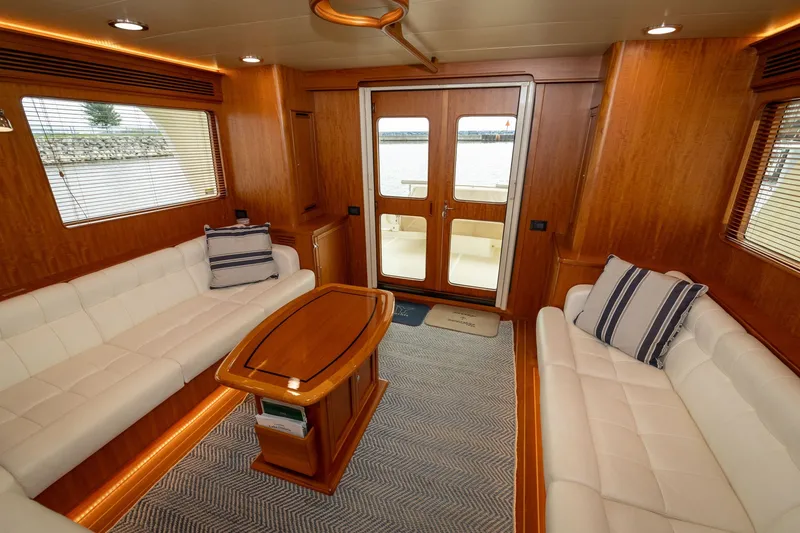 Slide: The Image of Luxurious interior of 2019 Marlow Explorer 49E yacht with elegant wood finish and plush seating. - 35