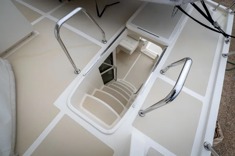 Slide: The Image of Stairway leading below deck on 2019 Marlow Explorer 49E yacht. - 76