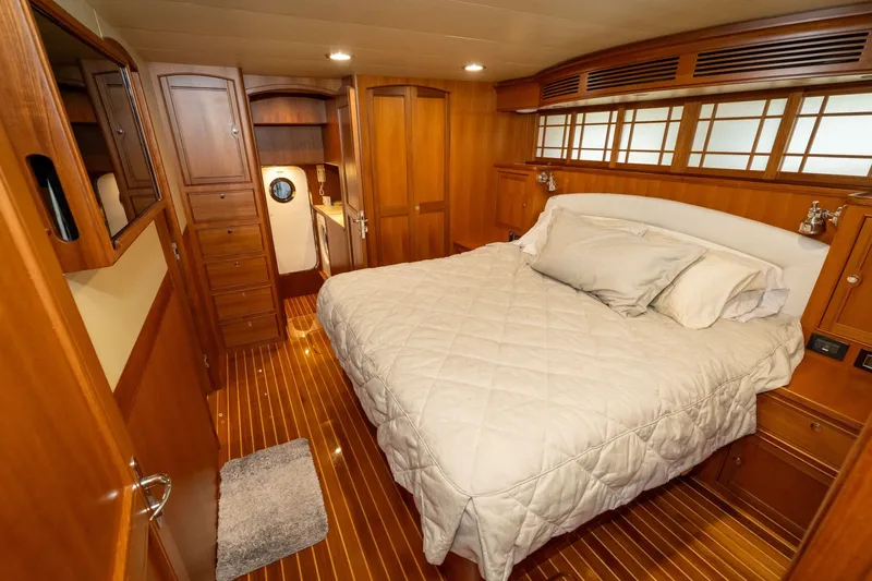 Slide: The Image of Luxurious cabin interior of 2019 Marlow Explorer 49E yacht with wood finish and cozy bedding. - 54
