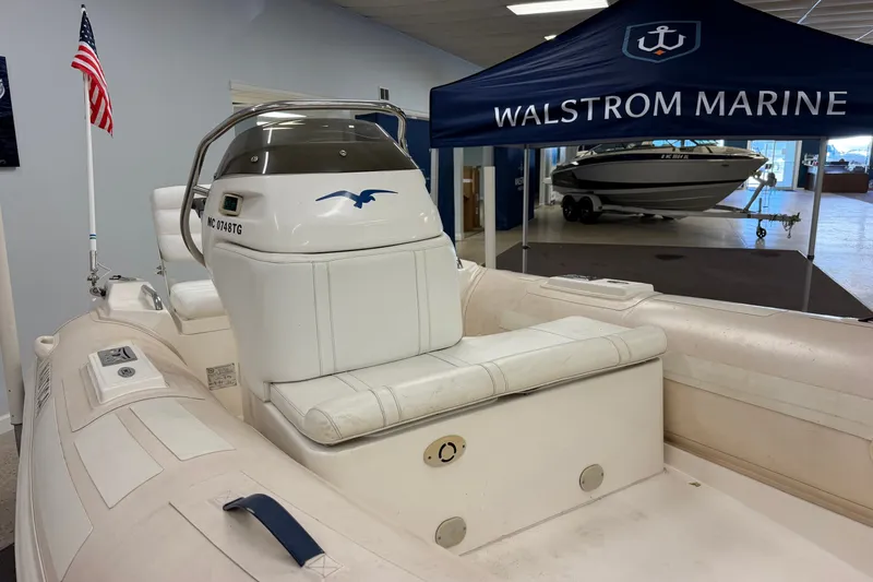 Slide: The Image of 2004 Nautica RIB 15 Widebody boat displayed at Walstrom Marine showroom. - 21