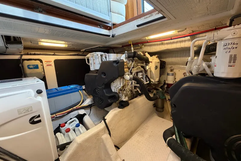 Slide: The Image of Engine room of a 2010 Sabre 40 Sedan yacht, showcasing mechanical components. - 24