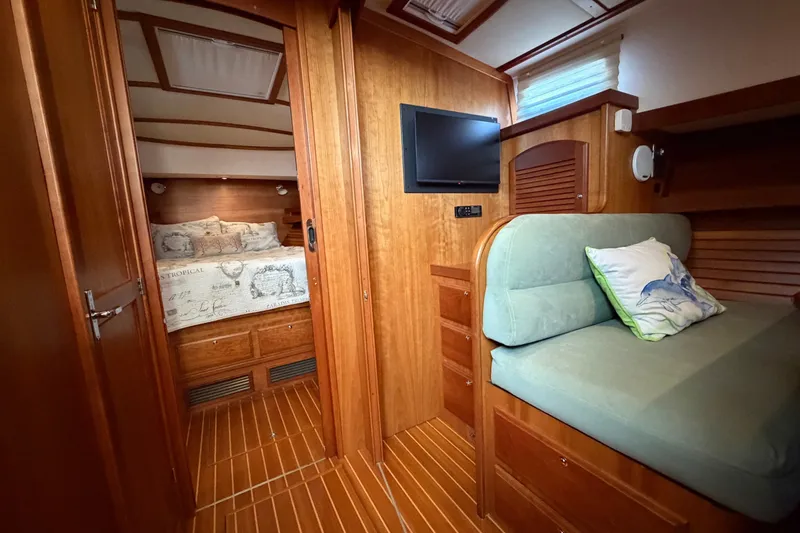 Slide: The Image of Interior of 2010 Sabre 40 Sedan yacht with cozy cabin and wooden finishes. - 23