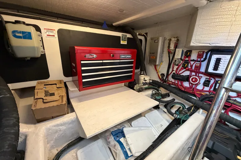 Slide: The Image of Engine room of 2010 Sabre 40 Sedan with red tool chest and organized wiring. - 26