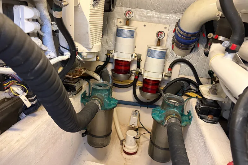 Slide: The Image of Engine room of a 2010 Sabre 40 Sedan with filters and hoses. - 25