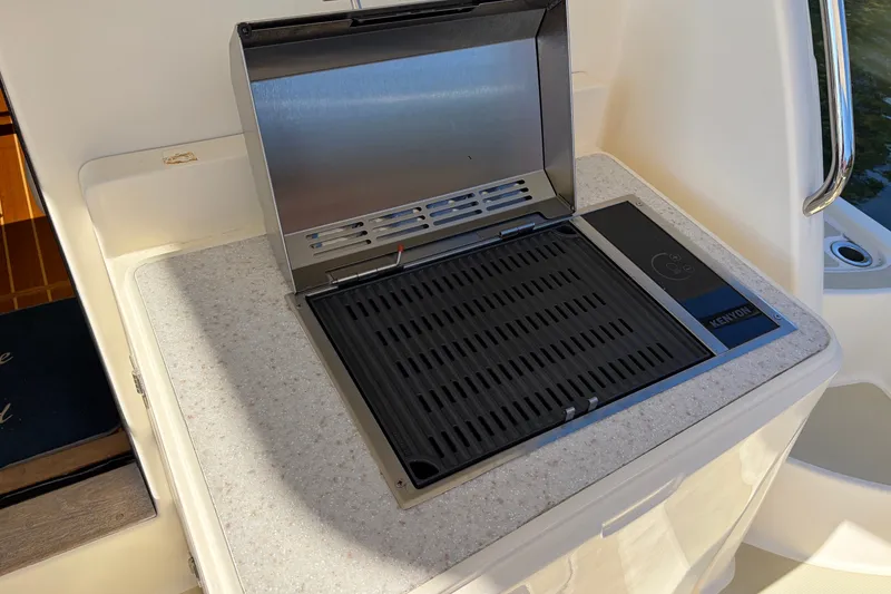 Slide: The Image of Built-in Kenyon grill on 2010 Sabre 40 Sedan yacht, featuring sleek countertop design. - 8