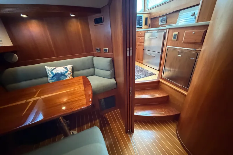 Slide: The Image of Luxurious interior of 2010 Sabre 40 Sedan yacht with wood finishes and modern kitchen. - 15