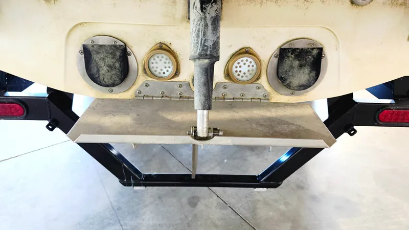 Slide: The Image of Rear view of a 2010 MasterCraft X-55 with two exhaust ports and a propeller. - 12