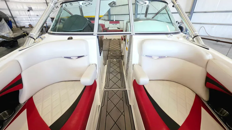 Slide: The Image of Interior view of a MasterCraft X-55 boat with white and red seating. - 10