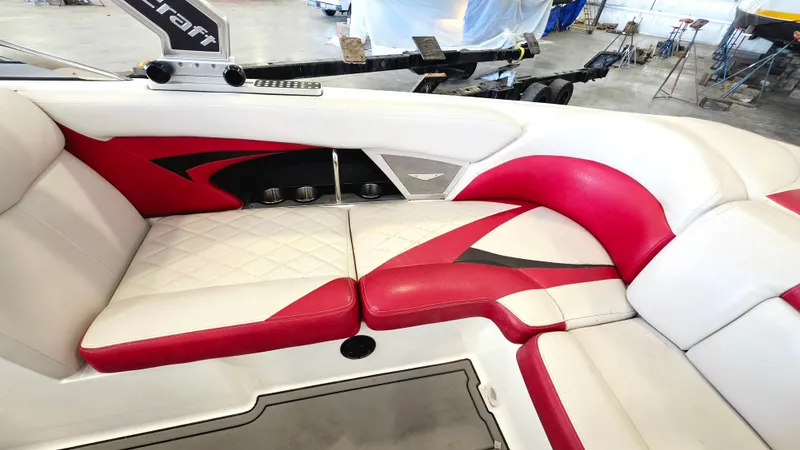 Slide: The Image of The 2010 MasterCraft X-55 features stylish red and white upholstery in its interior. - 2