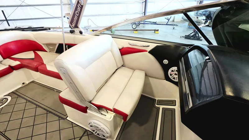 Slide: The Image of Interior of a 2010 MasterCraft X-55 with white and red seating. - 4