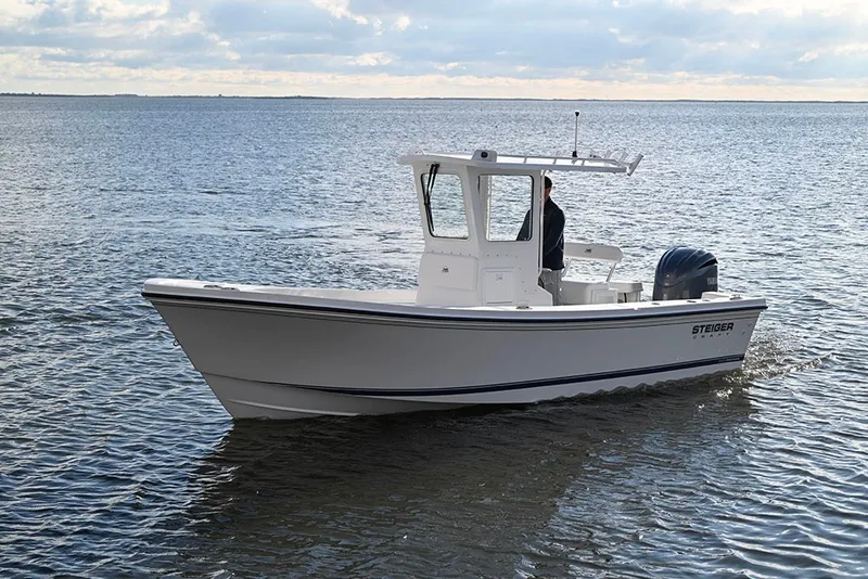 The Image of 2027 Steiger Craft 23 Chatham boat cruising on open water under a cloudy sky. - 1