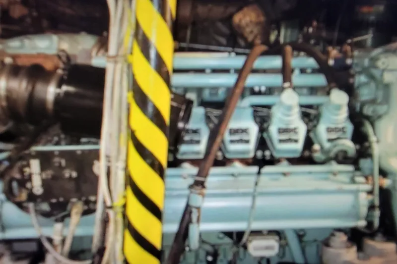 Slide: The Image of 1978 Blount Passenger engine with yellow-black safety stripe and visible wiring. - 23